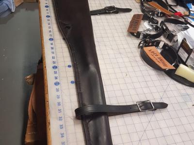 Rifle Scabbards Assorted And Some With Mounting Straps To Attach to What Ever You Ride. Horse Or Horse Powered Vehicle With Wheels. Custom, Full Grain Leather, Hand tooled, Hand made in the Okanagan, Oliver, B.C., Canada.