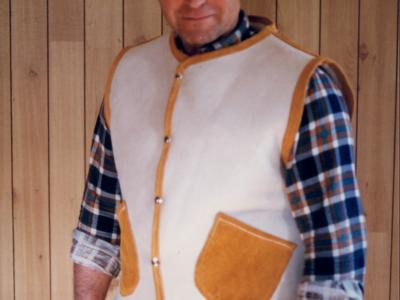 Sheep skin vest with deer skin pockets and trim